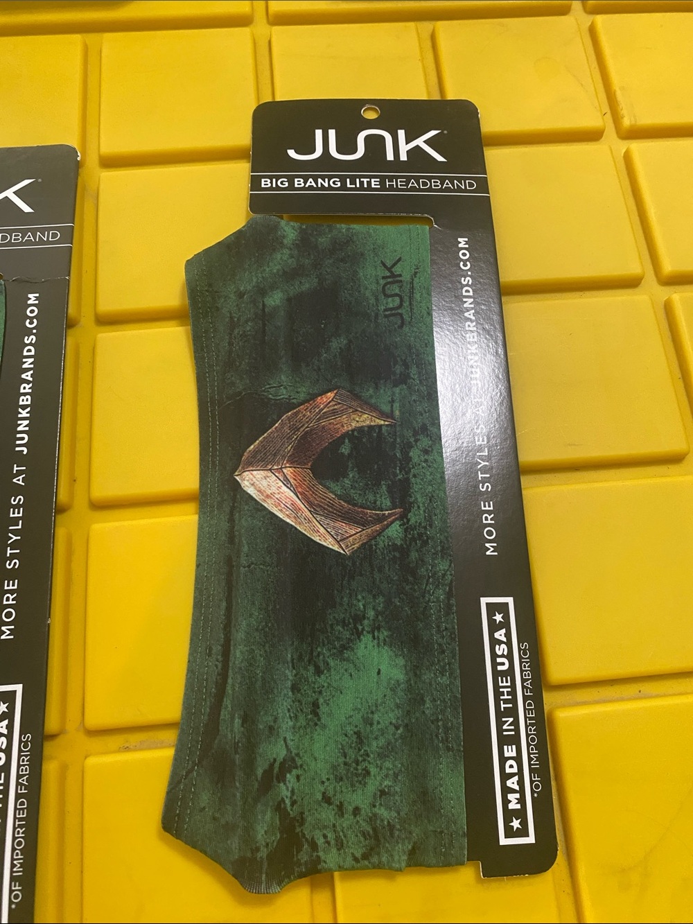 Junk Men’s Green Big Bang Lite Headband with Bronze Emblem